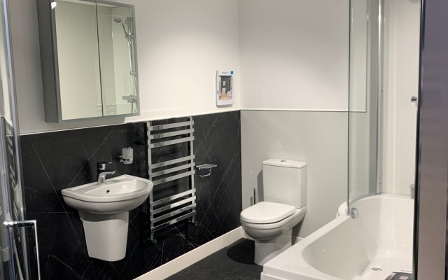 11 - Knaresborough Plumbing Supplies - Wall-hung Basin, Towel Warmer, Mirrored Cabinet Unit, Toilet, and Shower Bath